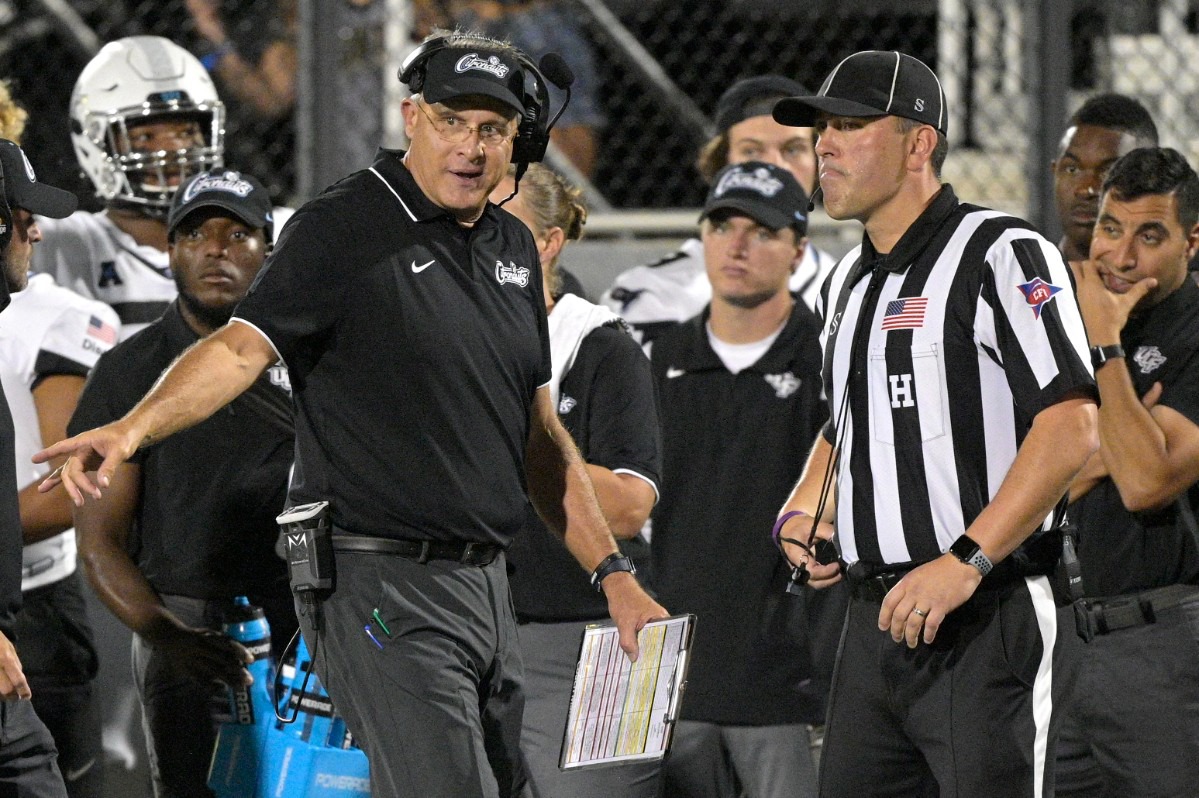 <strong>Central Florida coach Gus Malzahn, left, argues with an official in the game against Memphis on Oct. 22, 2021, in Orlando, Florida.</strong> (Phelan M. Ebenhack/Orlando Sentinel via AP)