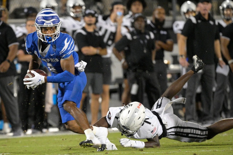 <strong>Memphis wide receiver Calvin Austin III (4) takes off after a successful reception in front of Central Florida defensive back Davonte Brown (7) on Oct. 22, 2021, in Orlando, Florida.</strong> (Phelan M. Ebenhack/Orlando Sentinel via AP)