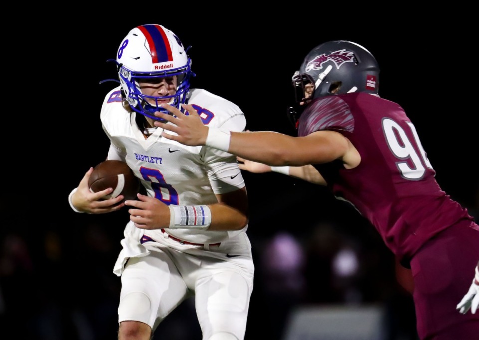 <strong>Bartlett quarterback Will Matthews (8) takes a hit during the Oct. 22 game against Collierville.</strong> (Patrick Lantrip/Daily Memphian)