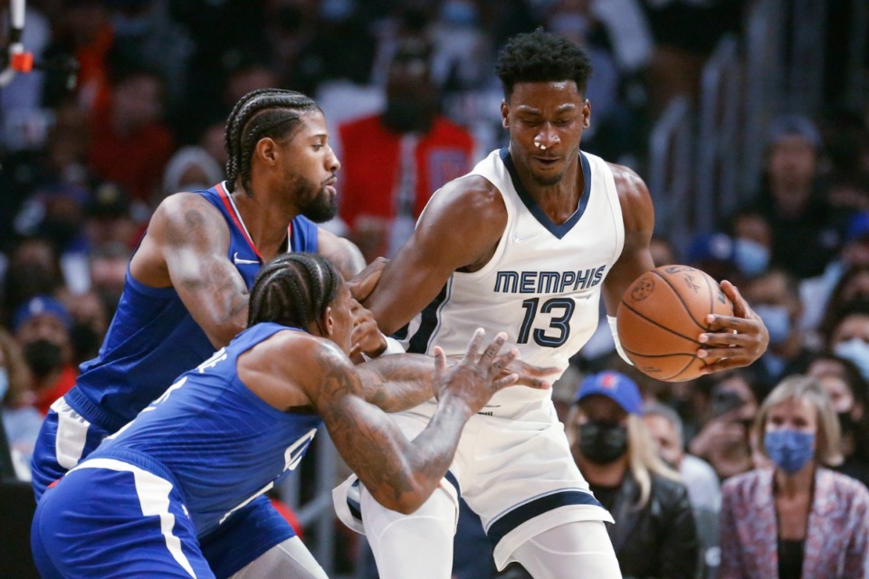 <strong>Memphis Grizzlies forward Jaren Jackson Jr. is defended by Los Angeles Clippers forward Paul George, top left, and guard Eric Bledsoe (12) during the first half of an NBA basketball game Saturday, Oct. 23, 2021, in Los Angeles.</strong> (AP Photo/Ringo H.W. Chiu)