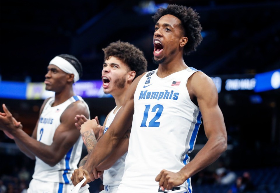 <strong>Tigers teammates (left to right) Jalen Duren, Lester Quinones and DeAndre Williams celebrate on the bench during action against LeMoyne-Owen College on Sunday, Oct. 24, 2021 at FedExForum.</strong> (Mark Weber/The Daily Memphian)