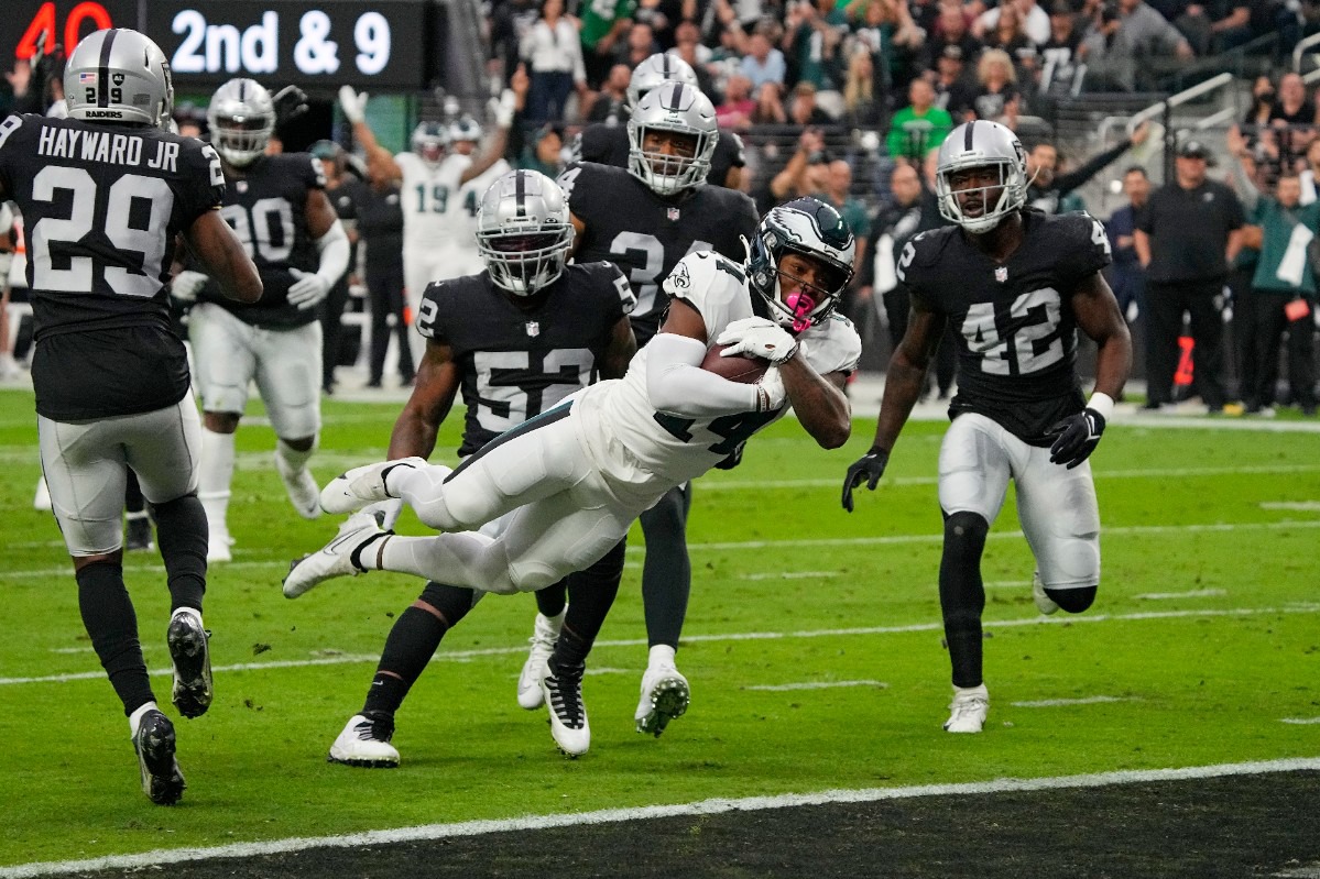 Philadelphia Eagles running back Kenneth Gainwell (14) scores on a