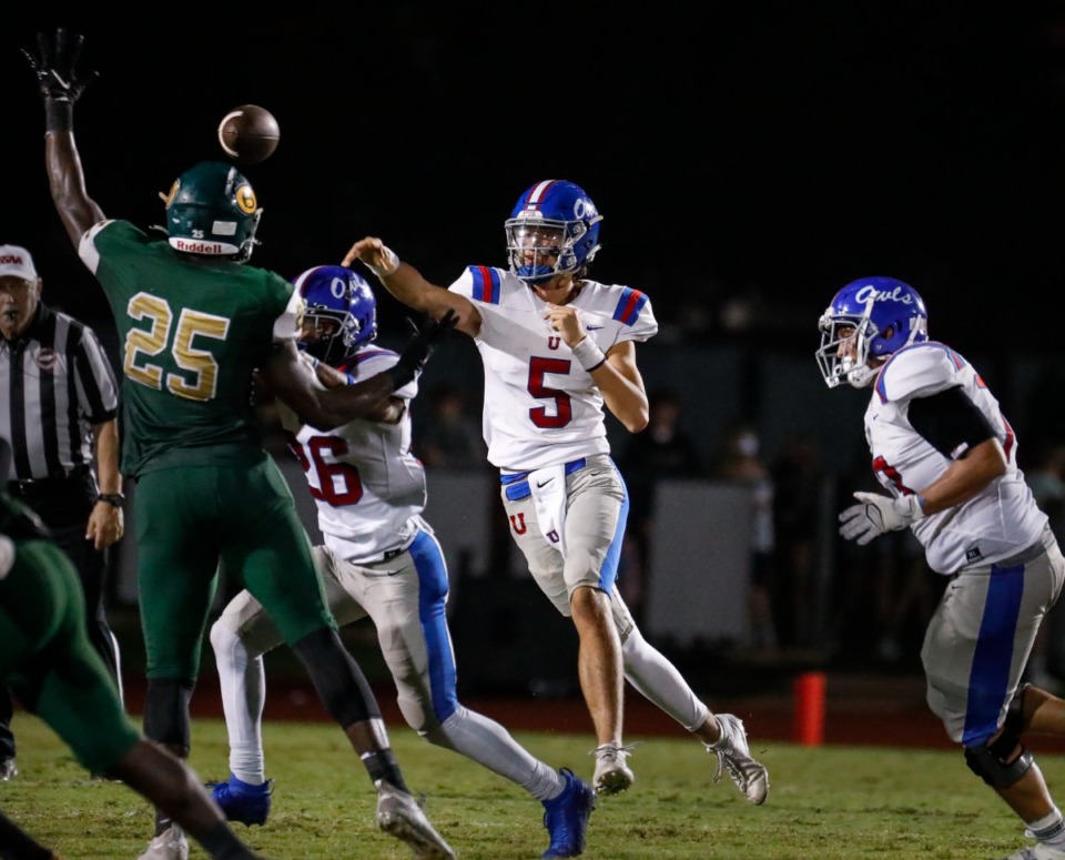<strong>MUS quarterback George Hamsley (middle) makes a pass against the Briarcrest defense during action on Friday, Oct. 1.</strong> (Mark Weber/Daily Memphian)