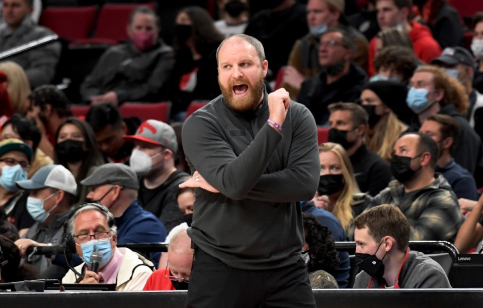 <strong>Memphis Grizzlies head coach Taylor Jenkins yells out to his team in the game against Portland on Oct. 27 in Portland.</strong> (Steve Dykes/AP)