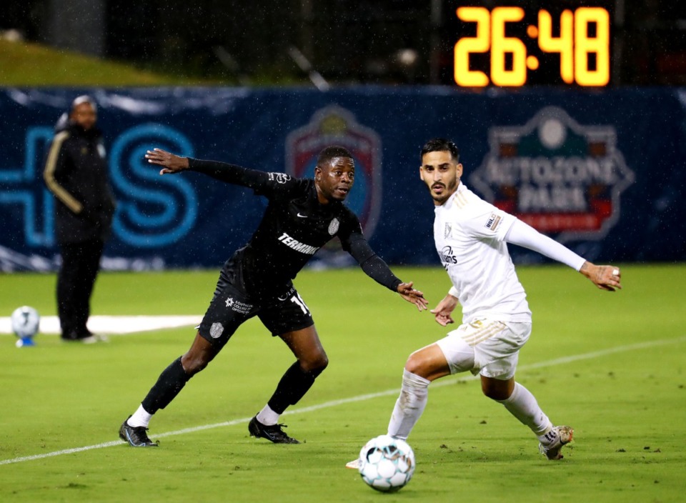 <strong>Memphis 901 FC midfielder Kadeem Dacres (10) brings the ball up the pitch in the rain during a Oct. 27, 2021 match against FC Tulsa.</strong> (Patrick Lantrip/Daily Memphian)