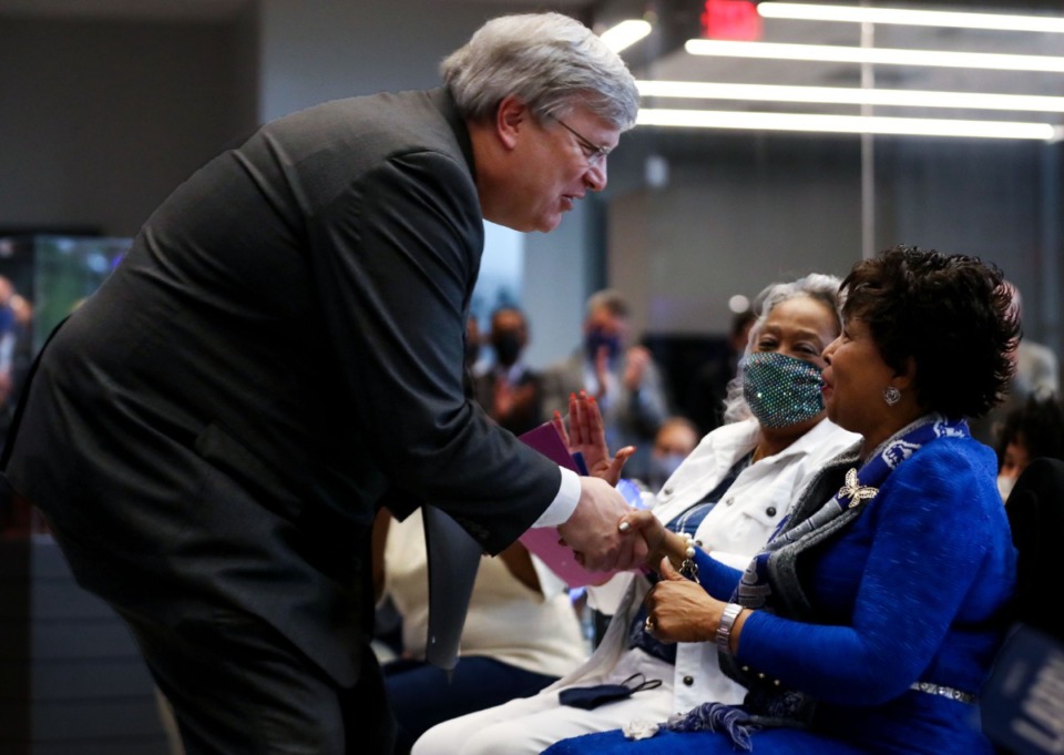 <strong>Memphis Mayor Jim Strickland gives a proclamation to Vicki Finch, the widow of former Memphis coach Larry Finch.</strong> (Patrick Lantrip/Daily Memphian)