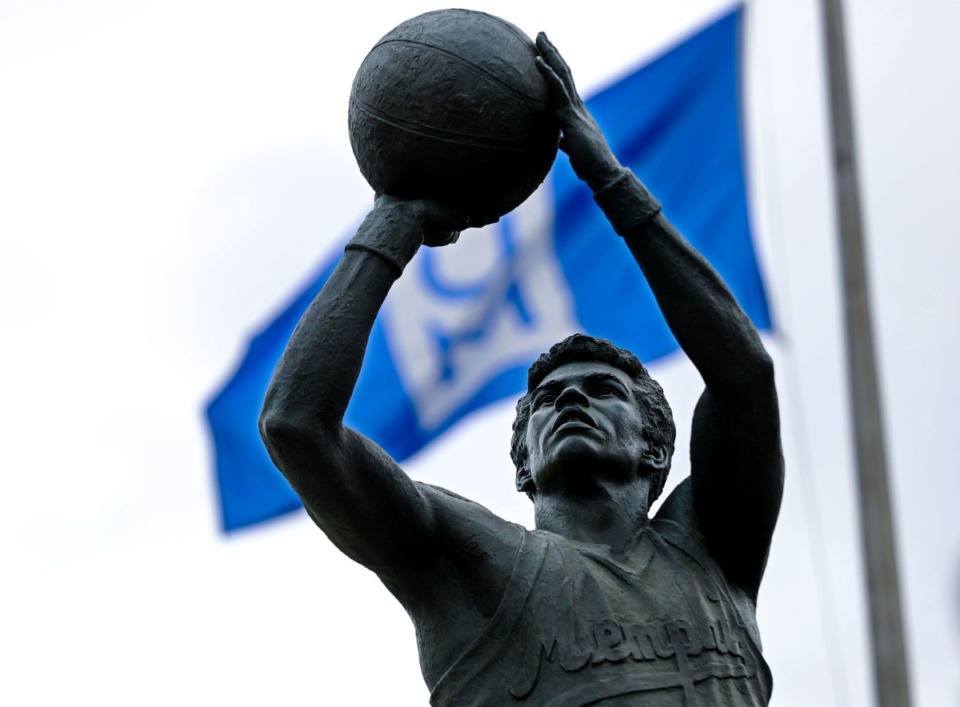 <strong>A University of Memphis flag billows in the background after a statue of Larry Finch was unveiled Thursday, Oct. 28.</strong> (Patrick Lantrip/Daily Memphian)