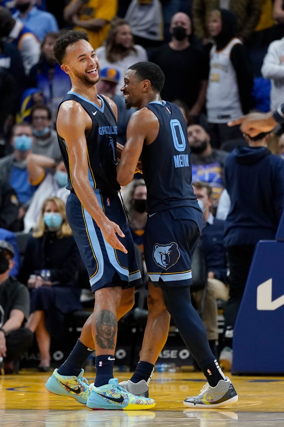 <strong>Grizzlies forward Kyle Anderson, left, celebrates with guard De'Anthony Melton during overtime in the game against Golden State</strong>&nbsp;<strong>in San Francisco on Oct. 28.</strong> (Jeff Chiu/AP)