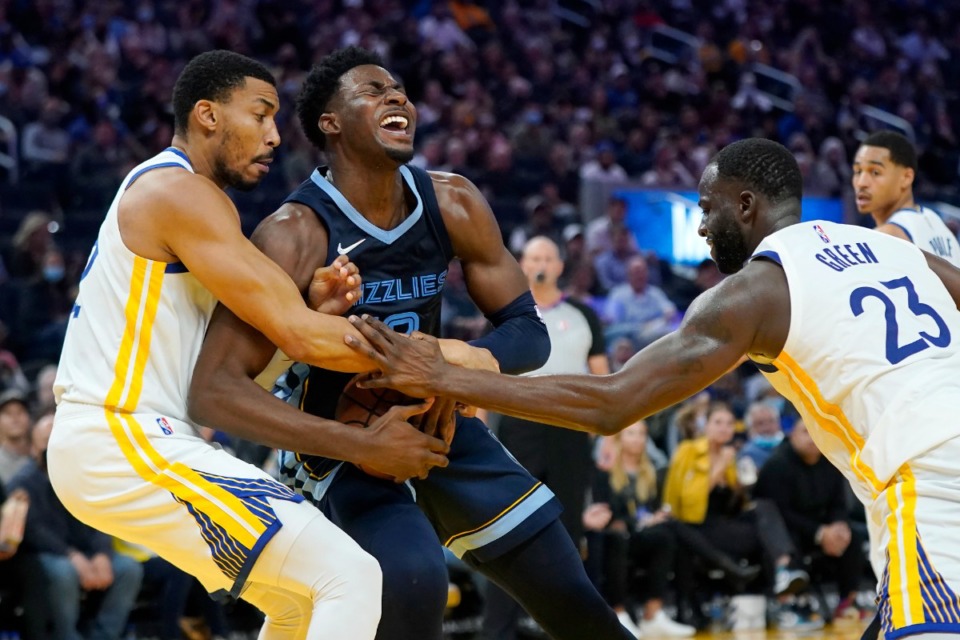 <strong>Grizzlies forward Jaren Jackson Jr., middle, is defended by Golden State Warriors forward Otto Porter Jr., left, and forward Draymond Green (23)</strong>&nbsp;<strong>in San Francisco on Oct. 28.</strong> (Jeff Chiu/AP)