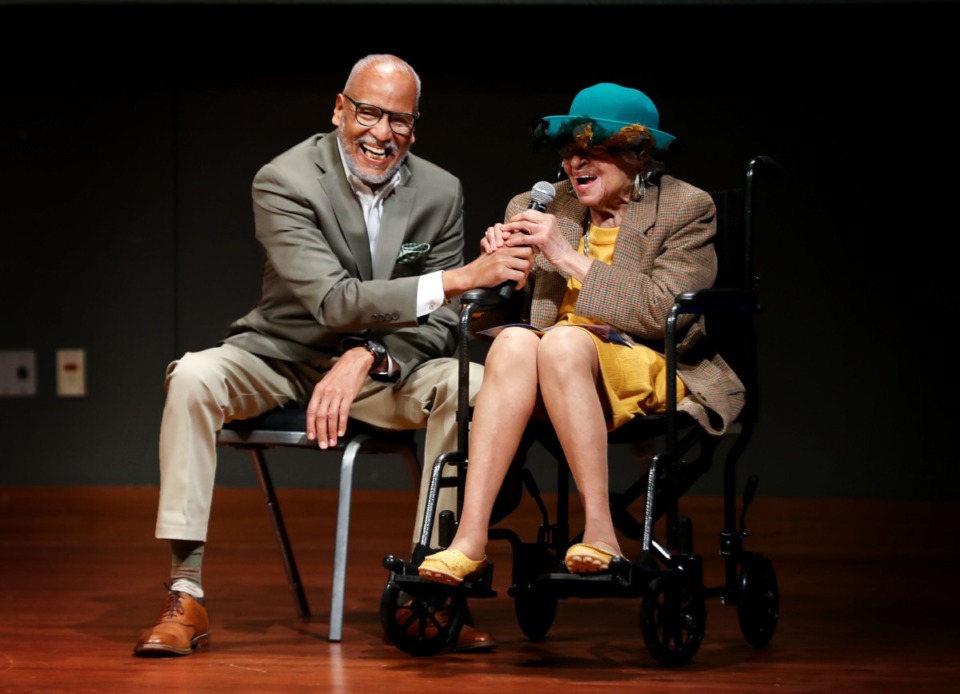 <strong>Clementine Ramsey, the sister of Maxine Smith, recalls a story from their childhood while sitting with her son, Ken Hughes, at an event honoring her late sister at the University of Memphis on Friday, Oct. 29.</strong> (Patrick Lantrip/Daily Memphian)