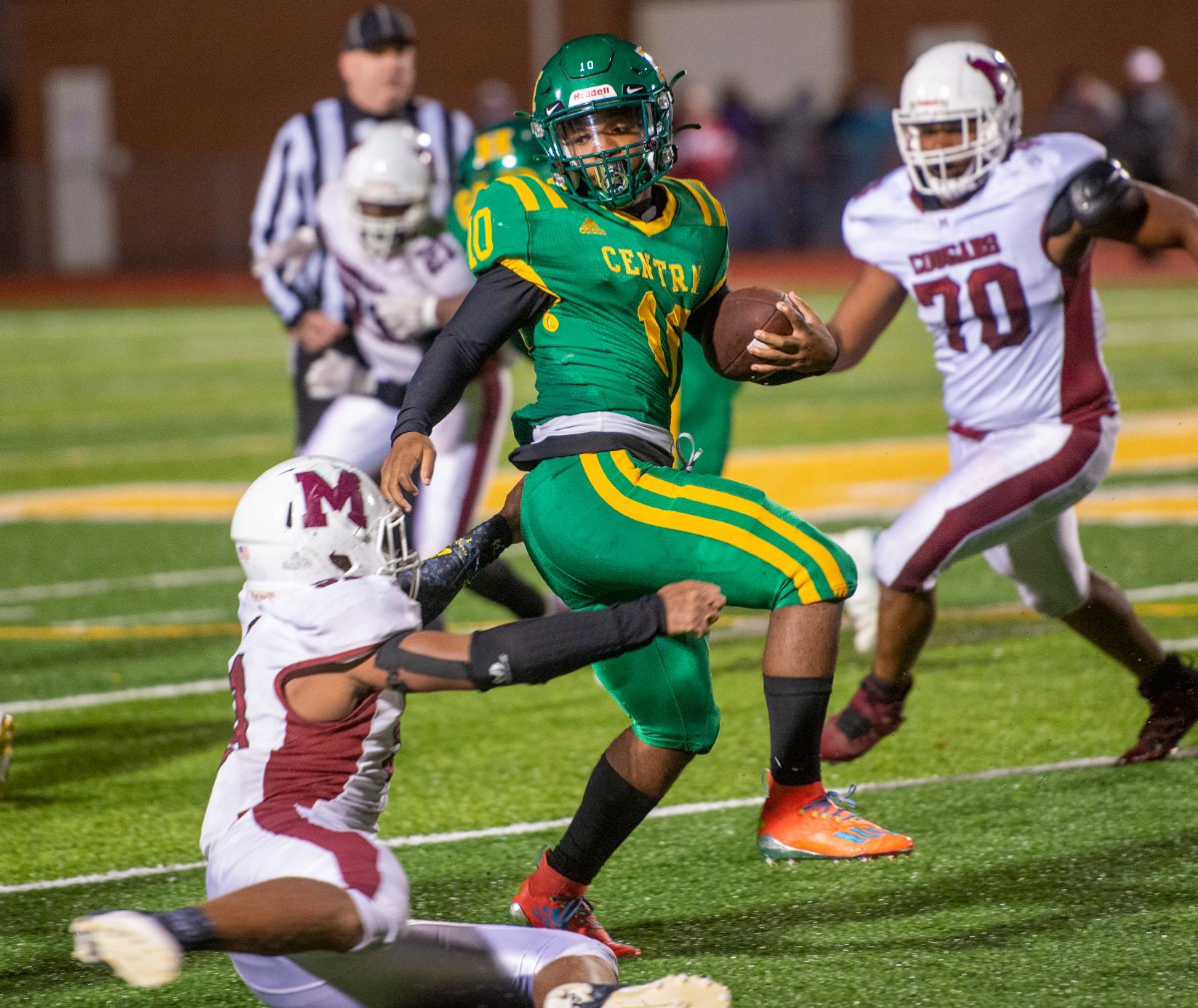 <strong>Central High School running back Jamarious Brooks tries to avoid Munford High School fullback D.J. Vassar during the Region 8-5A championship game at Crump Stadium on Friday, Oct. 29, 2021.</strong> (Greg Campbell/Special to The Daily Memphian)