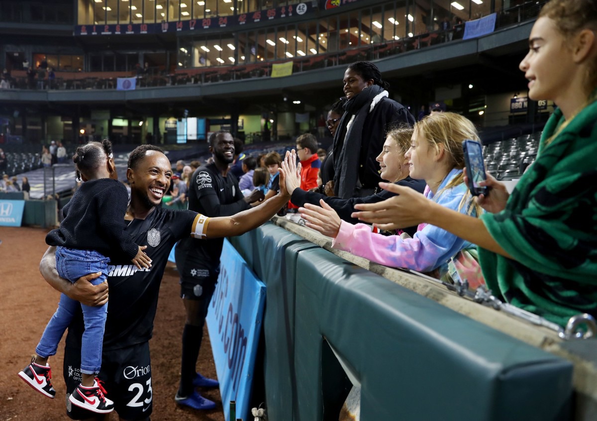 <strong>Memphis 901 FC defender Leston Paul (23) shakes hands with fans after an Oct. 30, 2021 match against Indy Eleven.</strong> (Patrick Lantrip/Daily Memphian)