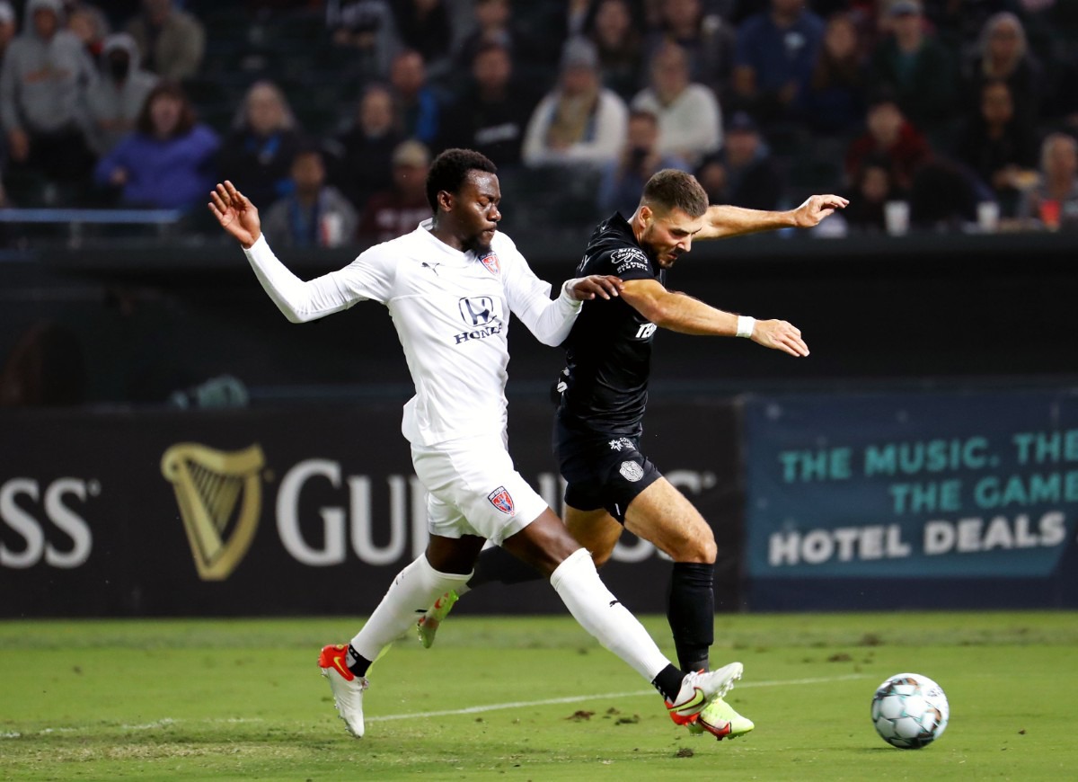 <strong>Memphis 901 FC forward Kyle Murphy (9) tries to shake his defender during an Oct. 30, 2021 match against Indy Eleven.</strong> (Patrick Lantrip/Daily Memphian)