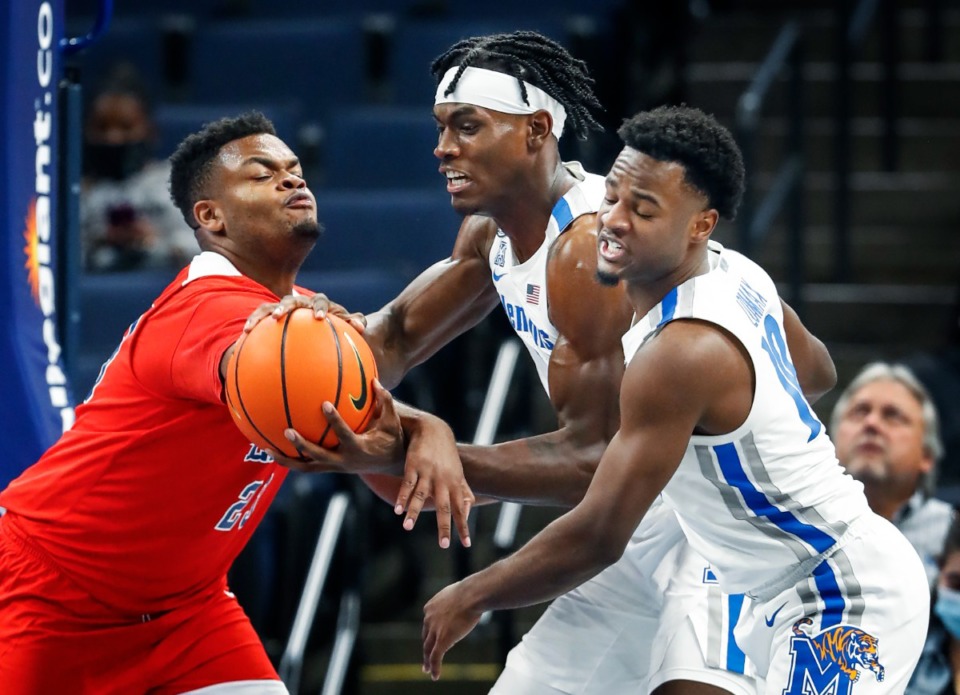 <strong>Memphis Tigers forward Jalen Duren (middle) has the ball knocked away by Lane College defender Kylan Haywood (left) as teammate Alex Lomax (right) helps on the play during action on Sunday, Oct. 31, 2021 at FedExForum.</strong> (Mark Weber/The Daily Memphian)