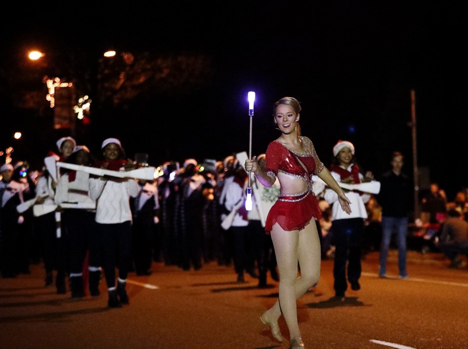 <strong>A dancer with an LED baton leads the way during the 43rd annual Collierville Christmas Parade on Dec. 6, 2019.</strong> (Patrick Lantrip/Daily Memphian)