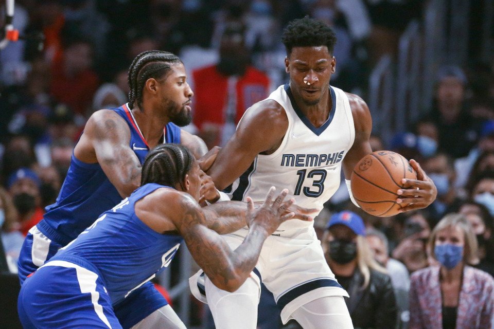 <strong>Memphis Grizzlies forward/center Jaren Jackson Jr., right, is working hard to overcome his slow start to the season and trying to not let any negative social media posts bother him. </strong>(AP file)
