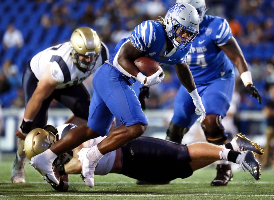 <strong>University of Memphis running back Brandon Thomas (22) dodges a Navy defender during a Oct. 14, 2021 game at the Liberty Bowl in Memphis, Tennessee.</strong> (Patrick Lantrip/Daily Memphian file)