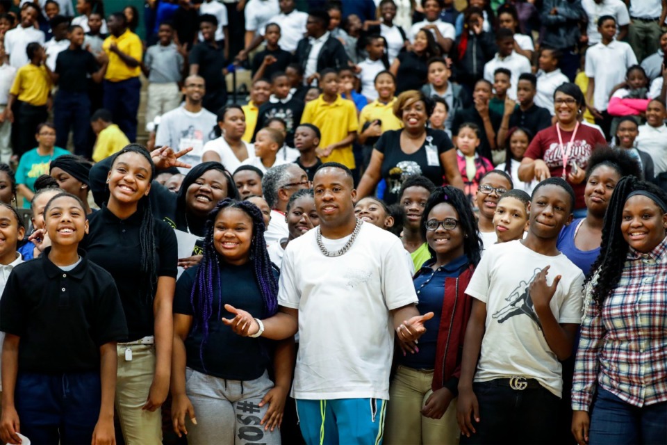 <strong>Rapper Yo Gotti (middle, in a 2019 file photo taken after he donated uniforms and hoodies to Grandview Heights Middle School students) recently tweeted that he wants to build a school.&nbsp;</strong>(Mark Weber/Daily Memphian)