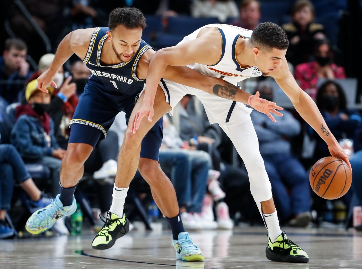 <strong>Grizzlies defender Kyle Anderson (left) tries to steal the ball from Denver Nuggets forward Michael Porter Jr. on Wednesday, Nov. 3.</strong> (Mark Weber/Daily Memphian)