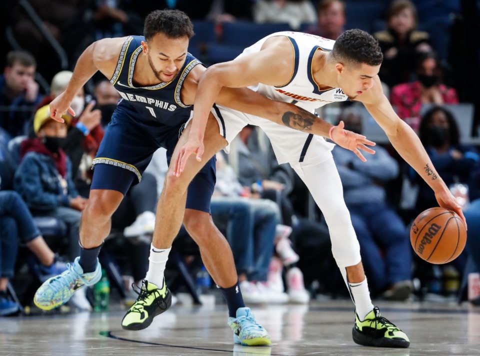 <strong>Grizzlies defender Kyle Anderson (left) tries to steal the ball away from Denver Nuggets forward Michael Porter Jr. (right) on Nov. 3, 2021.</strong> (Mark Weber/The Daily Memphian file)