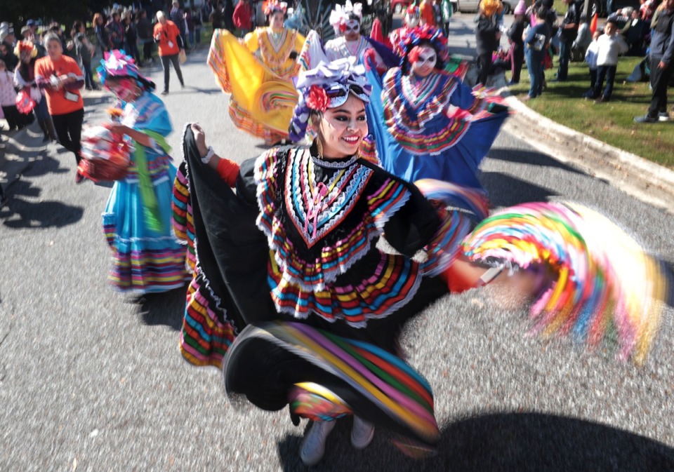 <strong>Dancers with make their way toward Overton Park during a Dia de los Muertos (Day of the Dead) parade.</strong> (Jim Weber/Daily Memphian file)