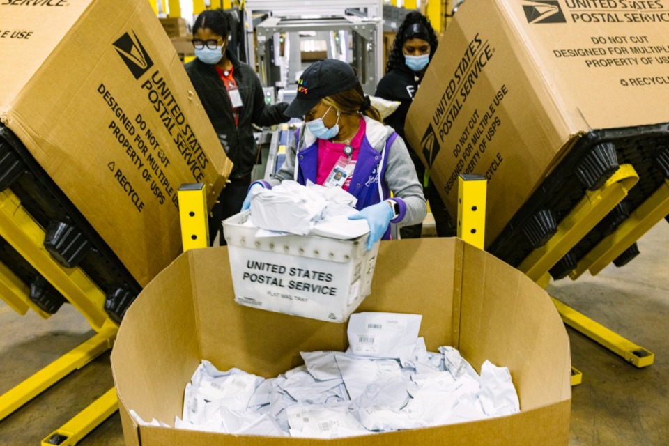 <strong>From left, Zuri Shaw, Terini Mims and Laquisha Mathis sort various postage at the USPS site in North Memphis on Nov. 5, 2021.</strong> (Ziggy Mack/Special to The Daily Memphian)
