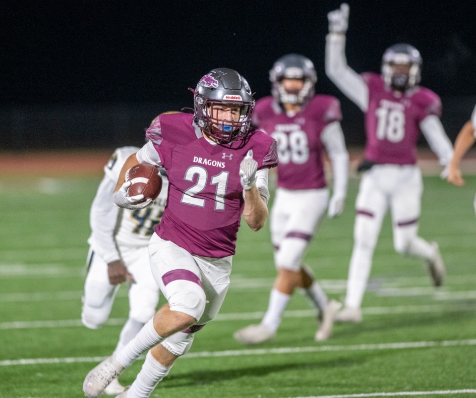 <strong>Collierville's Harrison Craig (21) runs a punt back for a touchdown against Independence High School on Friday, Nov. 5, 2021, at Collierville High School.</strong> (Greg Campbell/Special to The Daily Memphian)