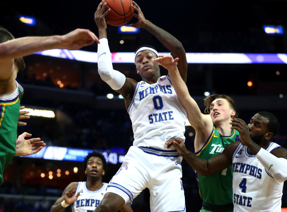 <strong>Memphis Tigers forward Kyvon Davenport (0) leaps for a rebound during a game against Tulane Green Wave on Wednesday, Feb. 20, 2019, in Memphis.</strong> (Houston Cofield/Daily Memphian)