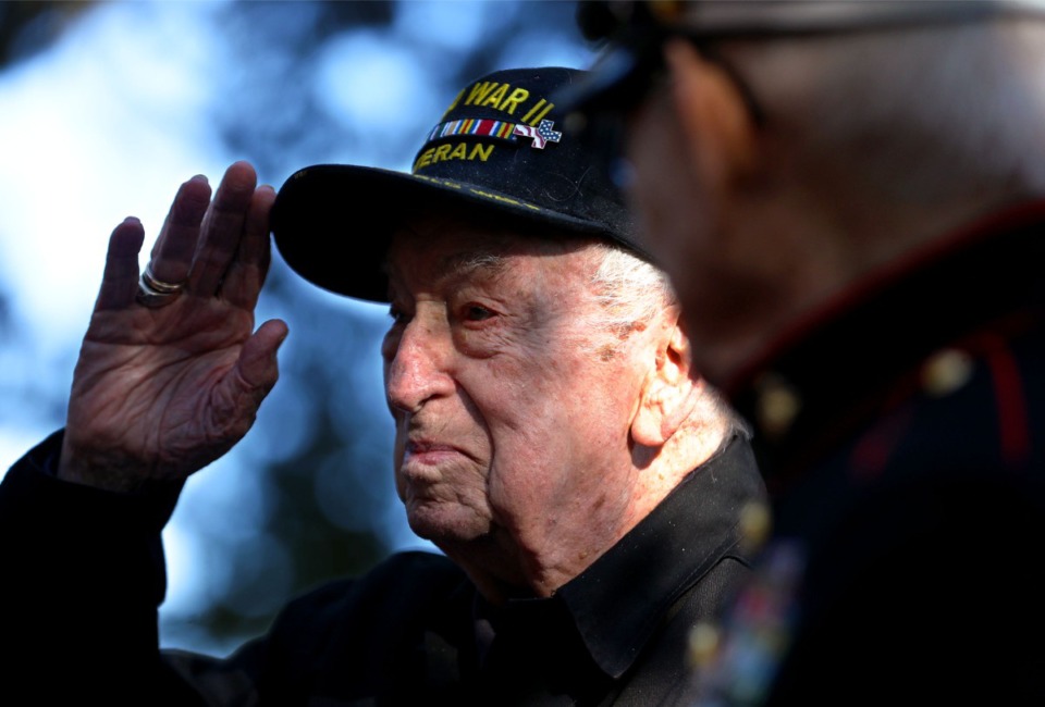 <strong>WWII Navy vet Jack Taylor salutes after being presented with an American Flag during a Veterans Day Celebration at Colliverville Town Square Nov. 7, 2021.</strong> (Patrick Lantrip/Daily Memphian)
