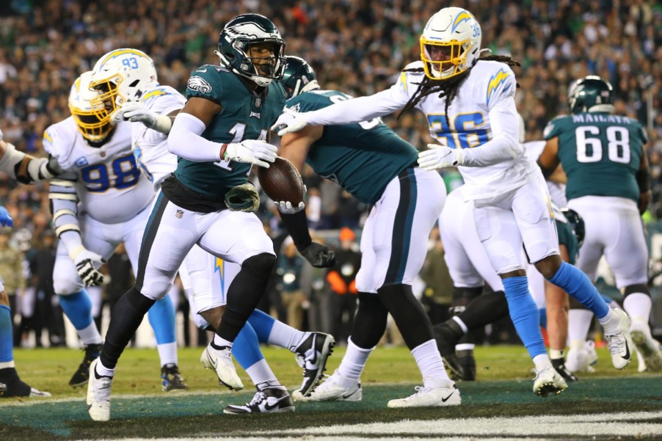 <strong>Philadelphia Eagles running back Kenneth Gainwell (14) scores a touchdown against the Los Angeles Chargers in the third quarter during an NFL football game, Sunday, Nov. 7, 2021, in Philadelphia.The Chargers defeated the Eagles 27-24.</strong> (AP Photo/Rich Schultz)