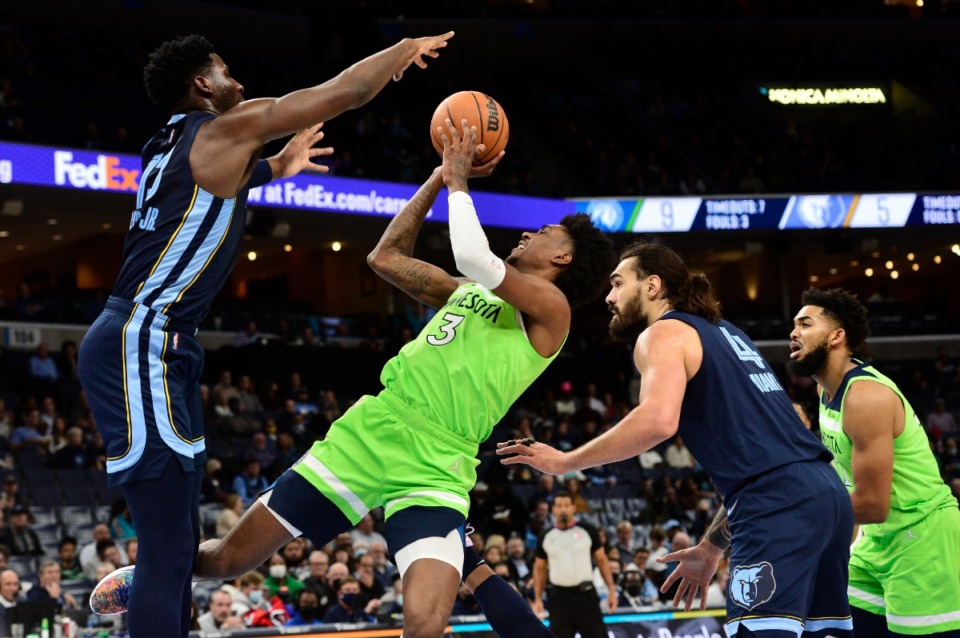 <strong>Grizzlies forward Jaren Jackson Jr. (13) attempts to block Minnesota&rsquo;s Jaden McDaniels (3) as centers Steven Adams (4) and Karl-Anthony Towns (32) move for position on Nov. 8 at FedExForum.</strong> (Brandon Dill/AP)
