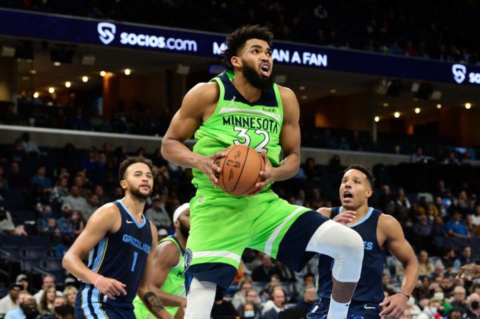 <strong>Timberwolves center Karl-Anthony Towns (32) grabs a rebound ahead of Memphis Grizzlies forward Kyle Anderson (1) and guard Desmond Bane at FedExForum on Nov. 8.</strong> (Brandon Dill/AP)