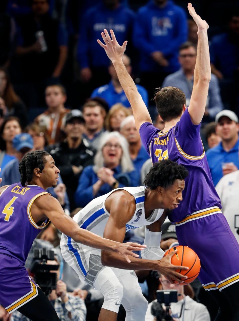 <strong>Tigers forward DeAndre Williams (middle) drives the lane against Tennessee Tech&rsquo;s Jr. Clay (left) and Shandon Goldman (right) on Tuesday, Nov. 9, 2021.</strong> (Mark Weber/The Daily Memphian)