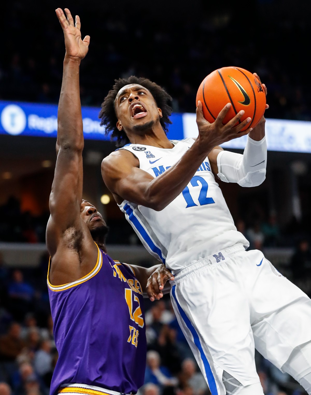 <strong>Tigers forward DeAndre Williams (right) drives the lane against Tennessee Tech&rsquo;s Mamoudou Diarra (left) on Tuesday, Nov. 9, 2021.</strong> (Mark Weber/The Daily Memphian)
