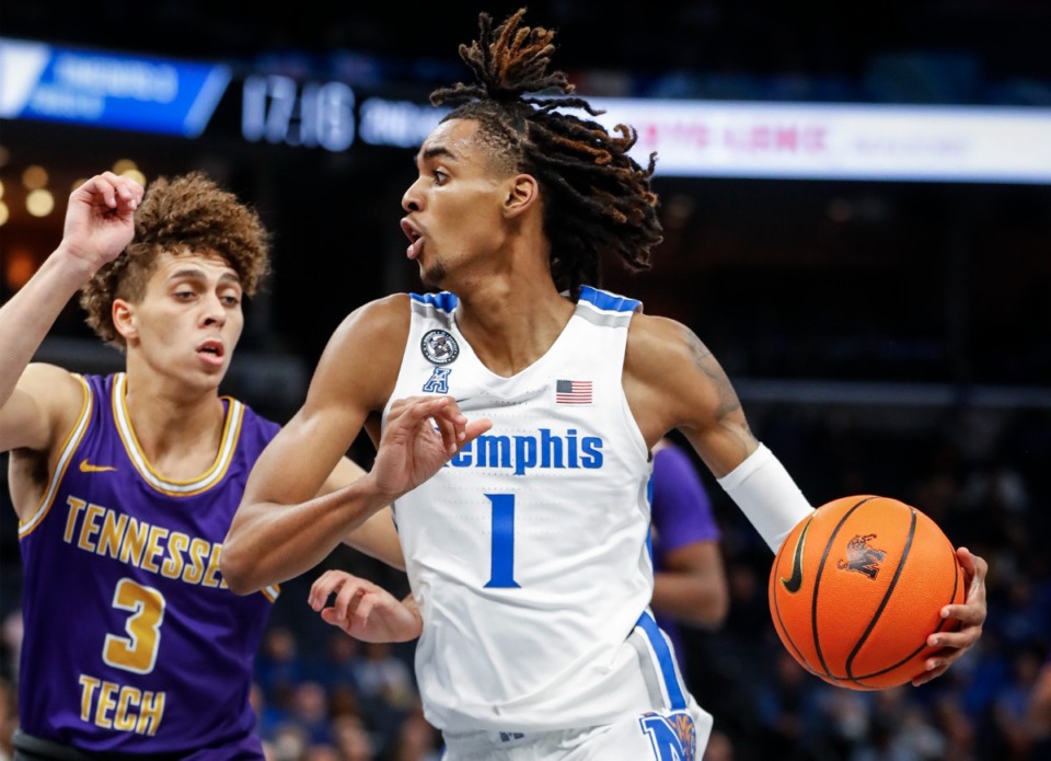<strong>Memphis Tigers guard Emoni Bates (right) drives the lane against Tennessee Tech defender Keishawn Davidson (left) during action on Tuesday, Nov. 9, 2021.</strong> (Mark Weber/The Daily Memphian)