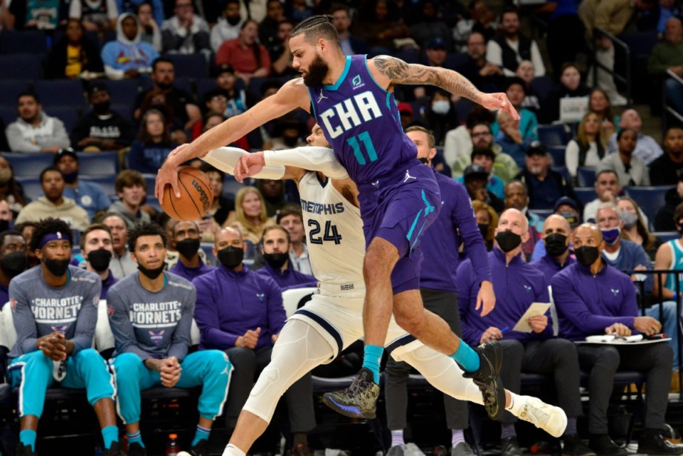 <strong>Charlotte Hornets forward Cody Martin (11) and Grizzlies forward Dillon Brooks (24) vie for control of the ball&nbsp;on Nov. 10 at FedExForum.</strong> (Brandon Dill/AP)