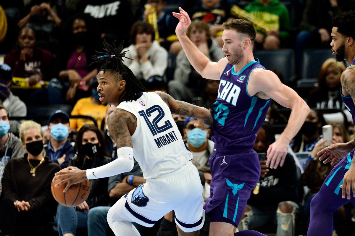 <strong>Grizzlies guard Ja Morant (12) looks for an openingl ahead of Charlotte Hornets forward Gordon Hayward (20) on Nov. 10 at FedExForum.</strong> (Brandon Dill/AP)