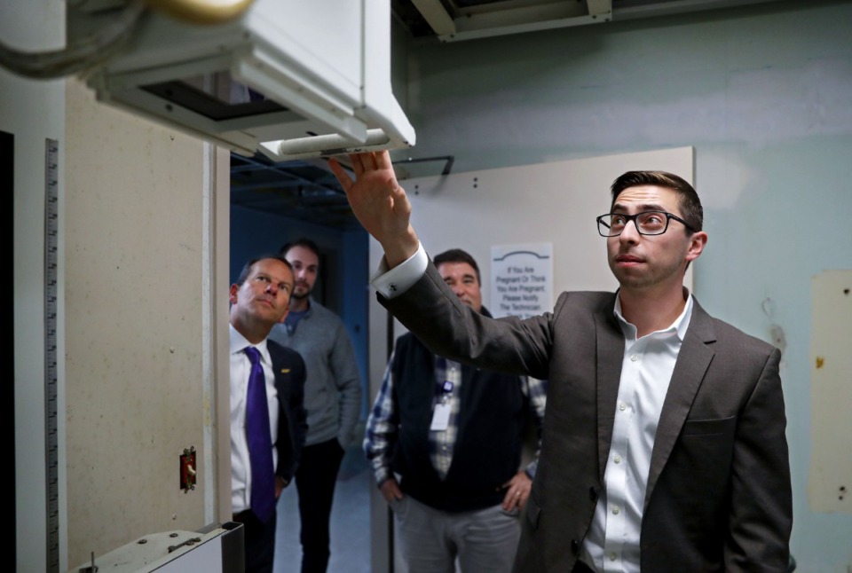 <strong>Kyle Kopec (right), Braden Health&rsquo;s chief compliance officer and director of government affairs, points out an X-ray machine from the 1960s that was still in use when Haywood County Community Hospital closed in 2014.</strong> (Patrick Lantrip/Daily Memphian)