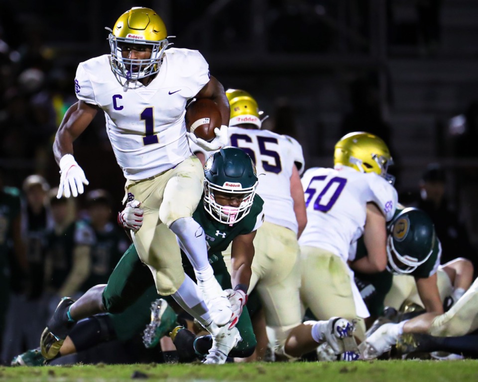 <strong>CBHS running back Dallan Hayden (1) breaks a tackle during the Nov. 12, 2021, game against Briarcrest.</strong> (Patrick Lantrip/Daily Memphian)