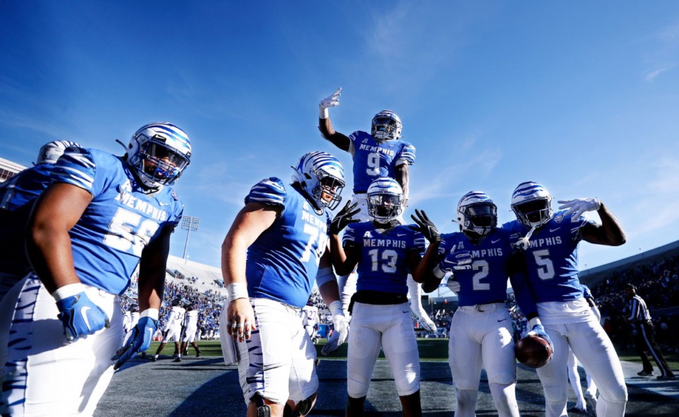 <strong>University of Memphis players celebrate a touchdown during a Nov. 13, 2021 game against ECU at the Liberty Bowl Memorial Stadium.</strong> (Patrick Lantrip/Daily Memphian)