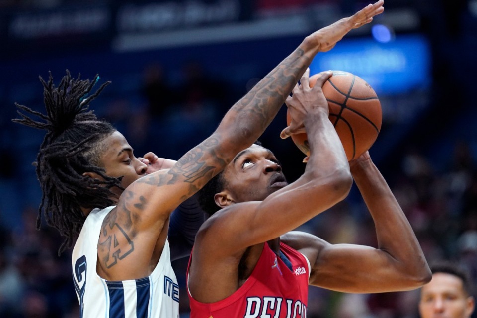<strong>New Orleans Pelicans forward Herbert Jones goes to the basket against Memphis Grizzlies guard Ja Morant in the first half of an NBA basketball game in New Orleans, Saturday, Nov. 13, 2021.</strong> (AP Photo/Gerald Herbert)