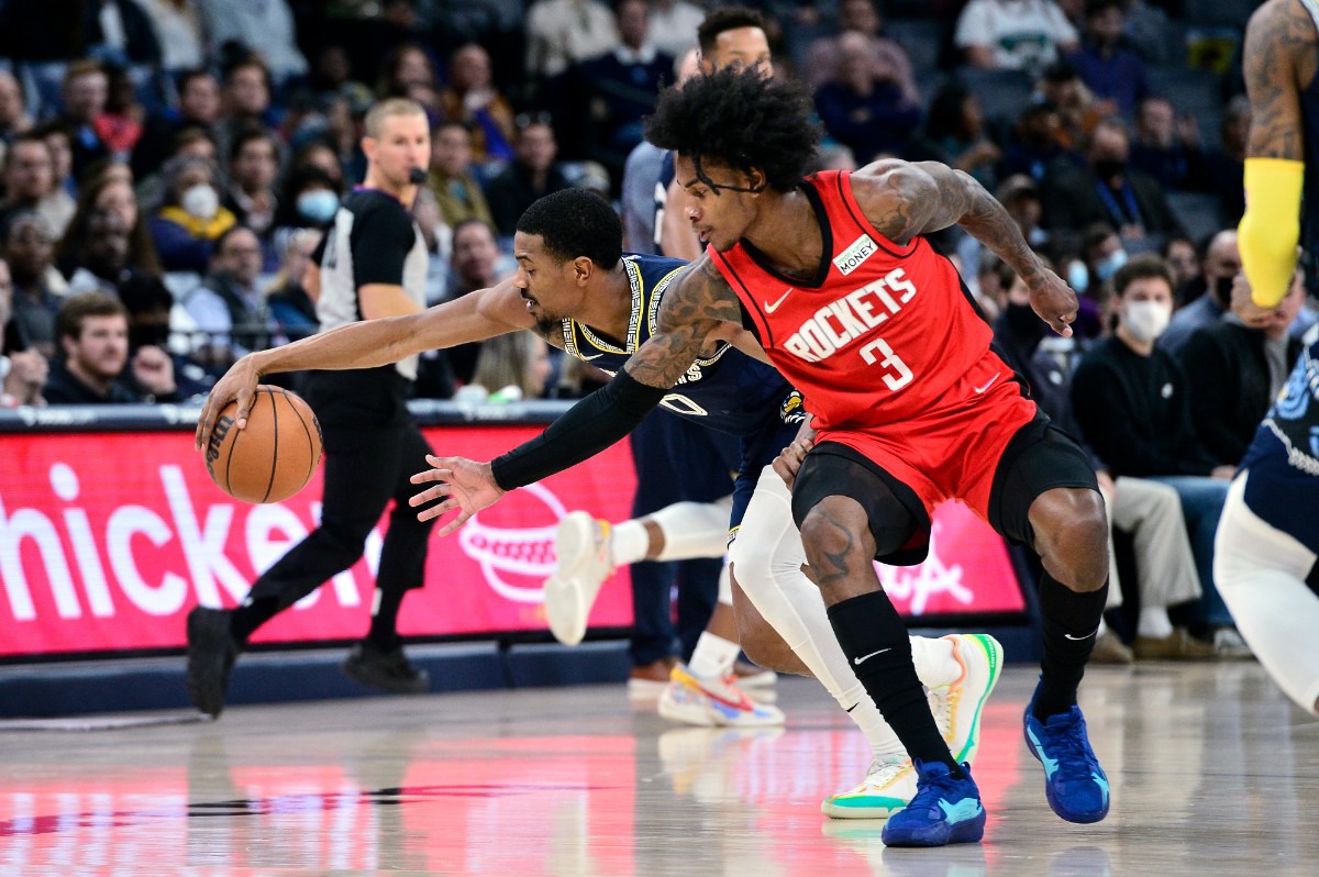 <strong>Grizzlies guard De'Anthony Melton (0) steals the ball from Houston Rockets guard Kevin Porter Jr. (3) on Nov. 15 at FedExForum.</strong> (Brandon Dill/AP)