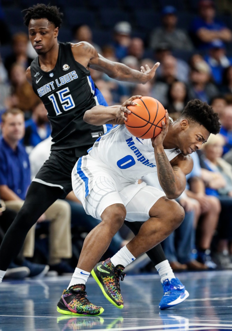 <strong>Memphis guard Earl Timberlake loses his footing while being guarded by Saint Louis defender Jordan Nesbitt during action on Tuesday, Nov. 16.</strong> (Mark Weber/Daily Memphian)