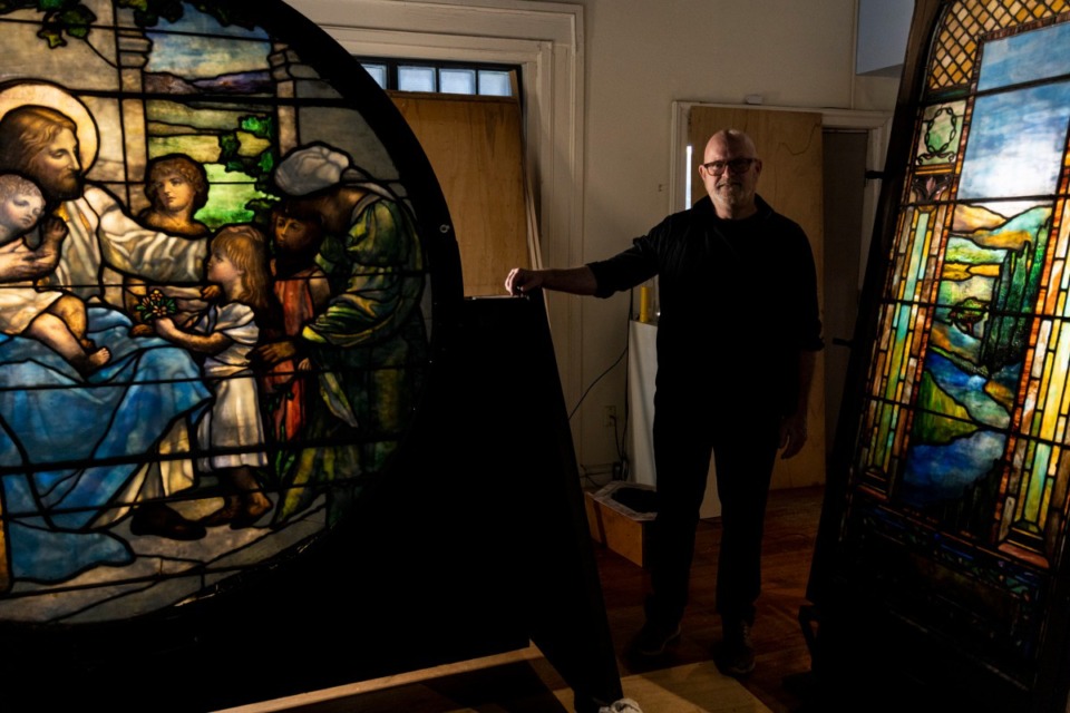 <strong>Scott Blake with some </strong><strong>stained-glass windows he is selling on behalf of the Episcopal Diocese of West Tennessee.&nbsp;</strong>(Brad Vest/Special to The Daily Memphian)