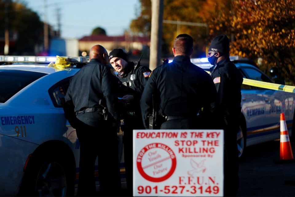 <strong>Memphis police officers respond to a shooting on Thursday, Nov. 18, at a memorial for Young Dolph, who was slain in a separate shooting at the Airways Boulevard address next door the day before.</strong> (Patrick Lantrip/Daily Memphian)