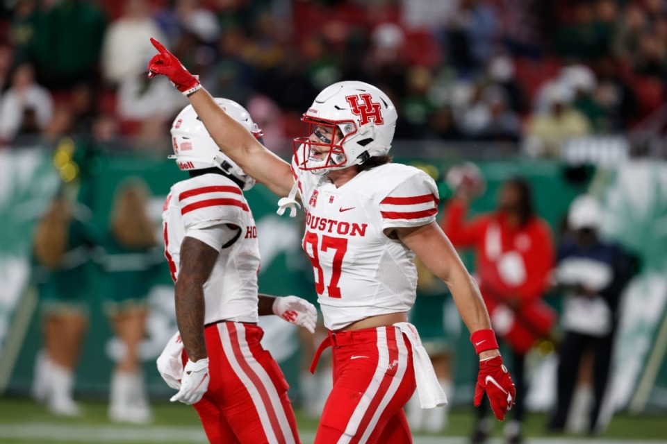 <strong>Houston Cougars wide receiver Jake Herslow gestures after scoring against South Florida on Nov. 6.&nbsp;No. 17 Houston (9-1, 7-0 AAC) has wrapped up a berth in the American Athletic Conference championship game and has a chance to finish conference play undefeated and extend its winning streak to 10 games with a win over Memphis.</strong> (Scott Audette/AP)