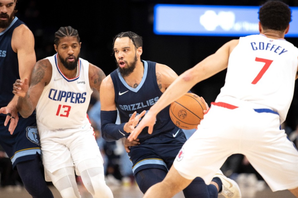 <strong>Grizzlies guard Dillon Brooks, center, drives into Los Angeles Clippers forward Paul George (13) and guard Amir Coffey (7) on Nov. 18, 2021, at FedExForum.</strong> (Nikki Boertman/AP)