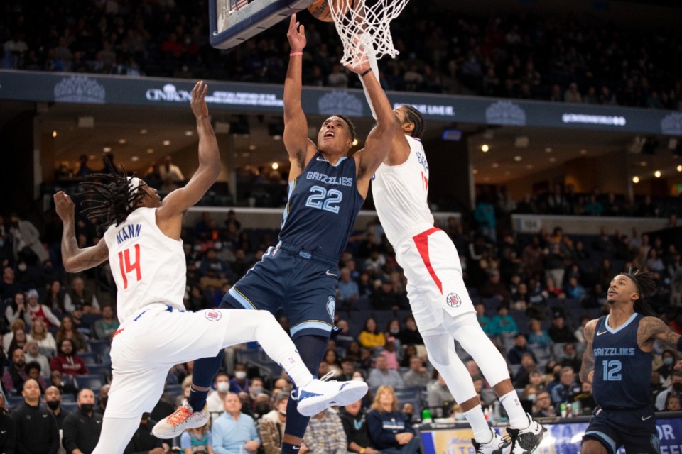 <strong>Grizzlies guard Desmond Bane (22) shoots against Los Angeles Clippers guard Terance Mann (14) and forward Paul George</strong>&nbsp;<strong>on Nov. 18, 2021, at FedExForum.</strong> (Nikki Boertman/AP)