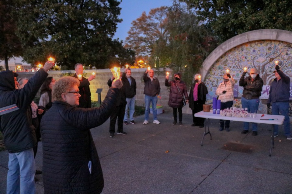 <strong>Kosten Foundation members lit candles and shared stories of loved ones they&rsquo;ve lost to pancreatic cancer during their 2021 Tribute at Twilight. The event was Thursday, Nov. 18 at Cancer Survivors Park in East Memphis.</strong> (Courtesy of the Kosten Foundation)