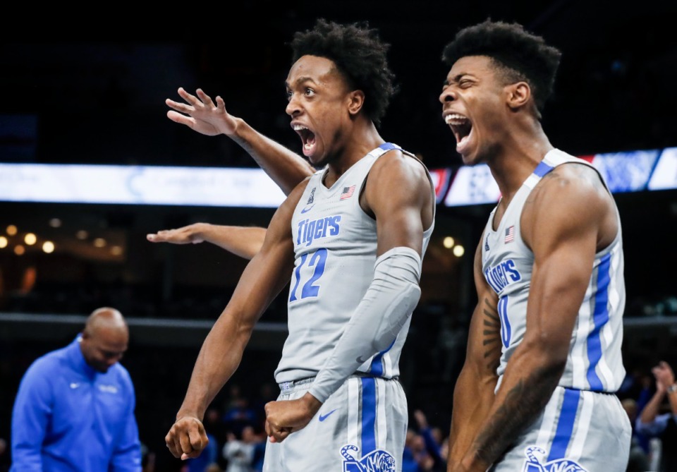 <strong>Tigers teammates DeAndre Williams (left) and Earl Timberlake celebrate during the final minutes of the victory over Western Kentucky on Friday, Nov. 19, 2021.</strong> (Mark Weber/The Daily Memphian)